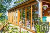 Blick auf den Wintergarten mit Terrasse
