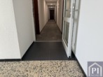 Glastür zwischen Treppenhaus und Flur